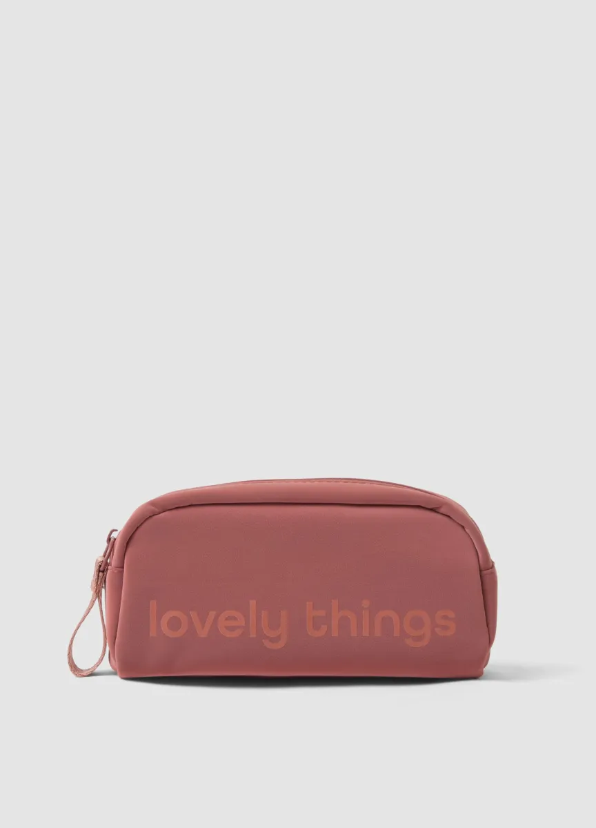 Beauty case rosa con zip e laccetto