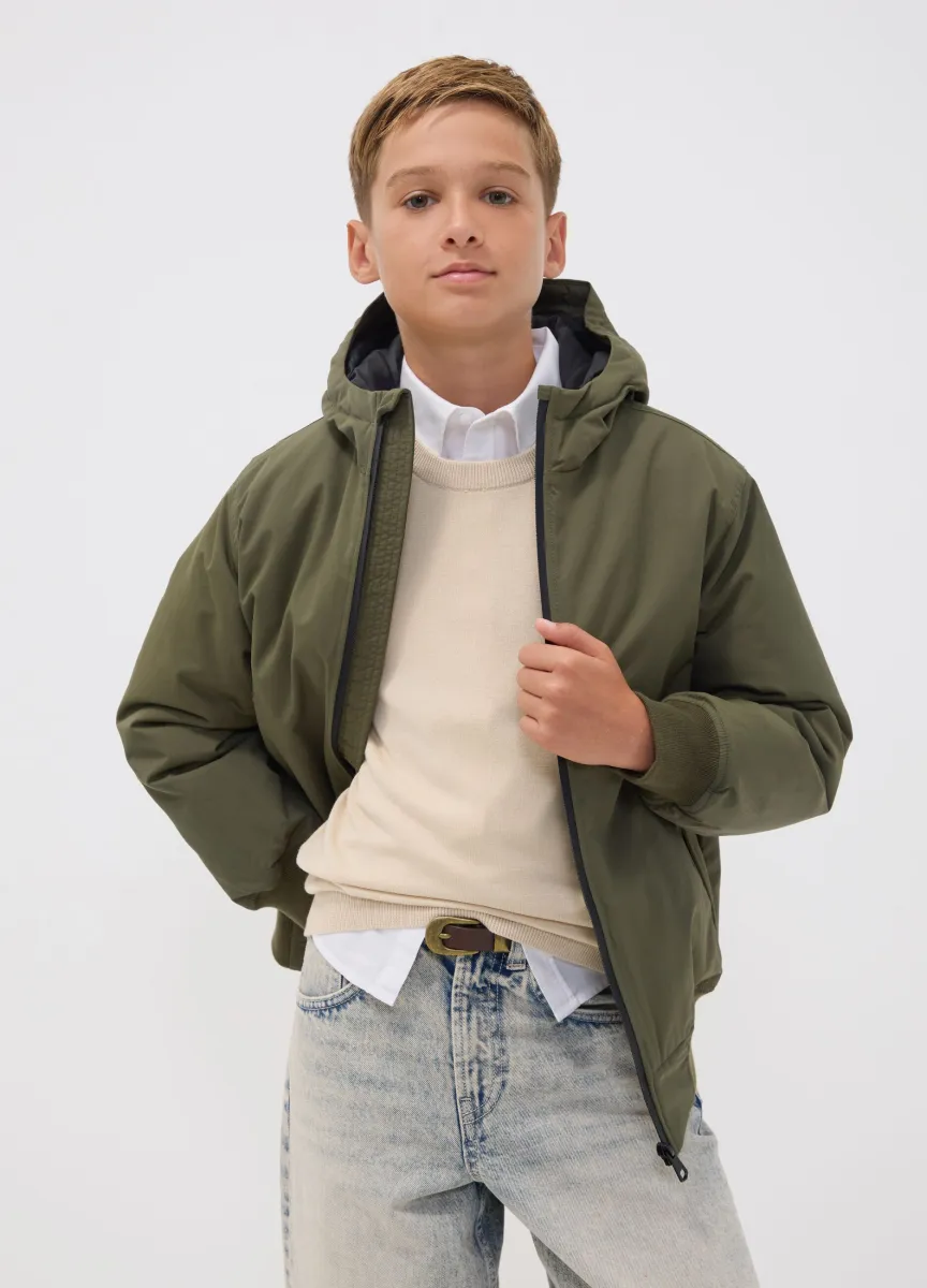 Bomber verde impermeabile con cappuccio e zip per ragazzo