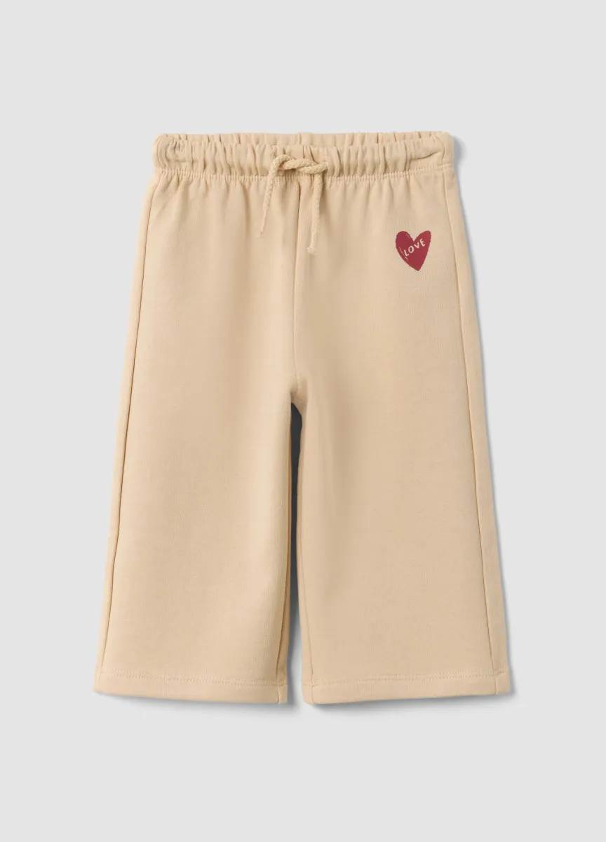Pantaloni beige in puro cotone con vita elastica e stampa per bimba