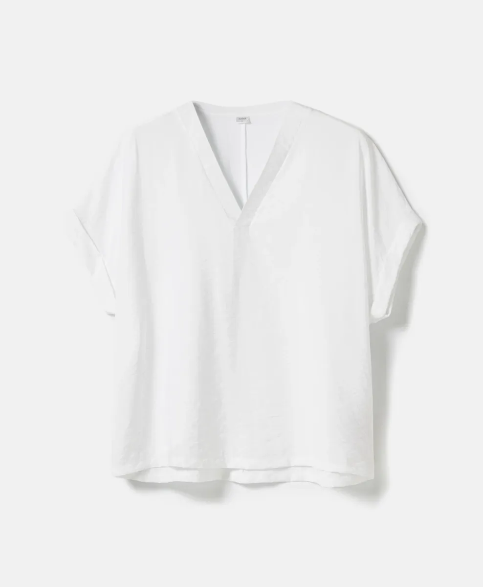 Blusa bianca da donna con scollo a V