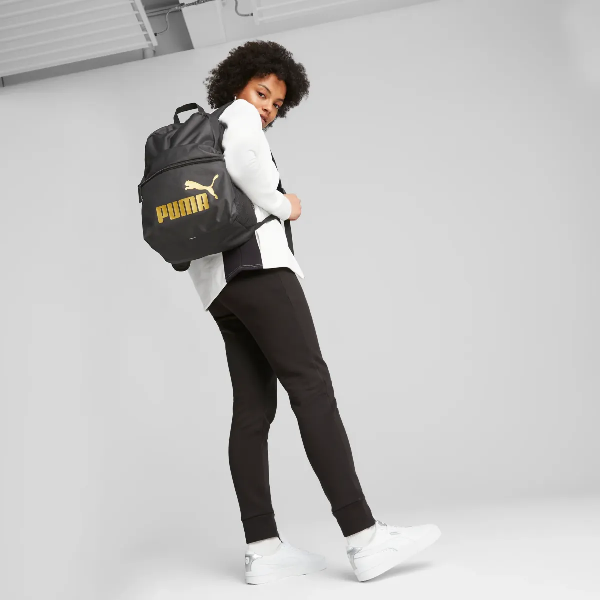 Zaino sportivo nero con logo oro Puma Phase